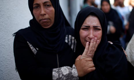 Mother of 8-month-old Palestinian infant Laila al-Ghandour, who died after inhaling tear gas during a protest against US embassy move to Jerusalem at the Israel-Gaza border, mourns during her funeral in Gaza City