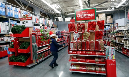 An employee checks on a Christmas display at a Walmart store in Chicago, Illinois, in 2016.