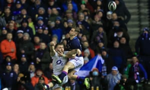 Luke Cowan-Dickie of England throws the ball into touch under pressure from Darcy Graham of Scotland resulting in a penalty try to Scotland and Yellow card .