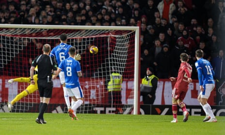 Leighton Clarkson of Aberdeen strikes from distance under pressure from James Sands of Rangers and scores to give Aberdeen a 2-1 lead.