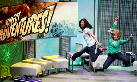 Assistants demonstrate the game Kinect Adventures for Xbox 360 during a media briefing in 2010.