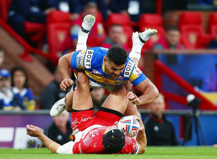 Rhyse Martin of Leeds Rhinos concedes a penalty kick for this tackle on Jonny Lomax of St Helens.