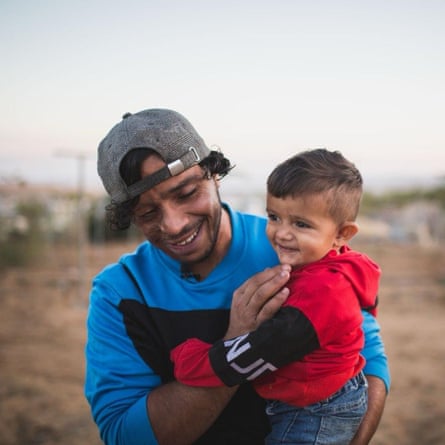 Awdah and his eldest son, Watan, in Umm Al-Khair in November 2021.