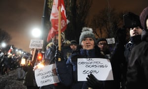 People protest in Warsaw against the ruling Law and Justice party after it intervened to appoint five judges of its choosing to the Constitutional Tribunal.