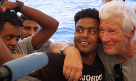 Richard Gere is seen with refugees onboard the Open Arms vessel