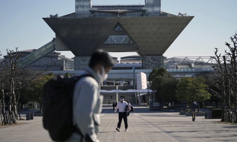 People walk past the Tokyo International Exhibition Centre in Tokyo, Japan.