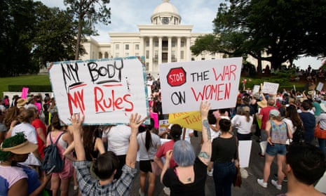 People gather at the Alabama State Capitol to protest against the state’s new abortion law.