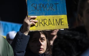 A woman holds a sign at a rally in Times Square to denounce the Russian invasion of Ukraine in New York. A woman holds a sign at a rally in Times Square to denounce the Russian invasion of Ukraine in New York.
