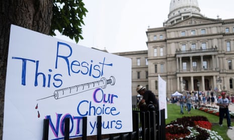 A sign left behind outside the Michigan State Capitol building after an anti-vaccine protest in August 2021.