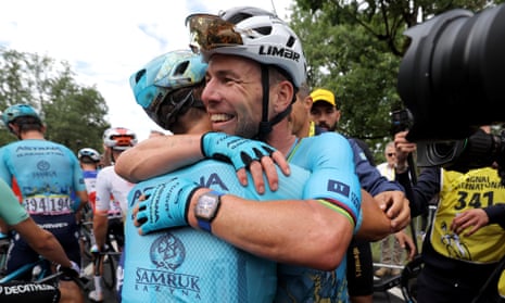 Mark Cavendish with teammate Alexey Lutsenko after his record-breaking 35th stage win in the Tour de France.
