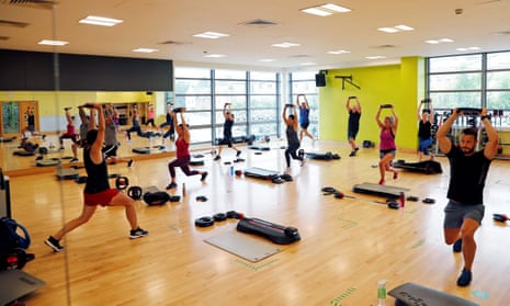 People take part in an exercise class at a Nuffield gym in Sunbury-on-Thames, west of London, pre-lockdown in July 2020.