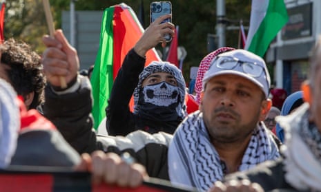 People take part in a march in Manchester calling for a free Palestine and an end to the conflict in Gaza.