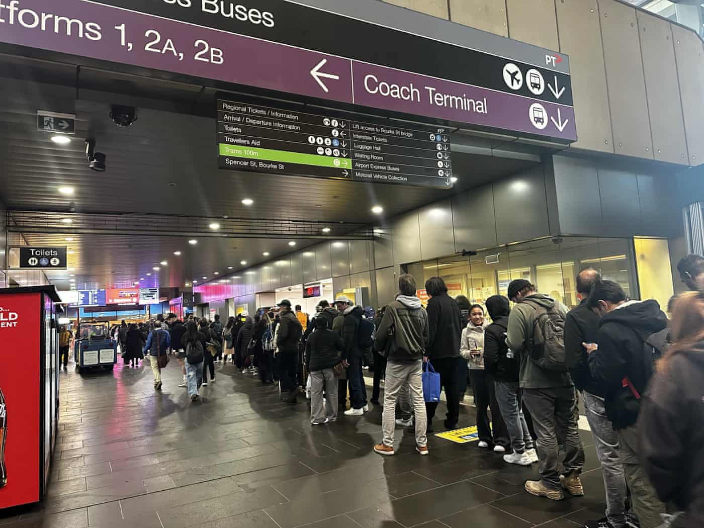 Peak hour commuters waiting at Southern Cross station in Melbourne