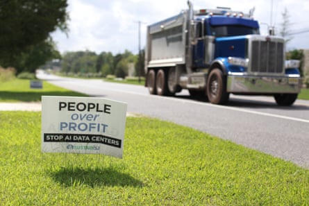 A sign next to a truck