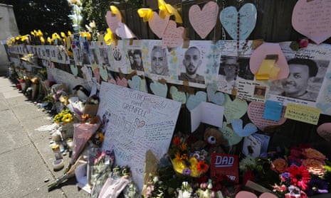 A wall near Grenfell Tower is covered with messages, flowers and tributes for the victims of the blaze.