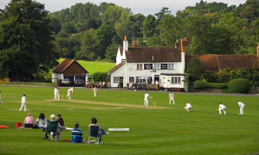 Cricket on the village green in Surrey.