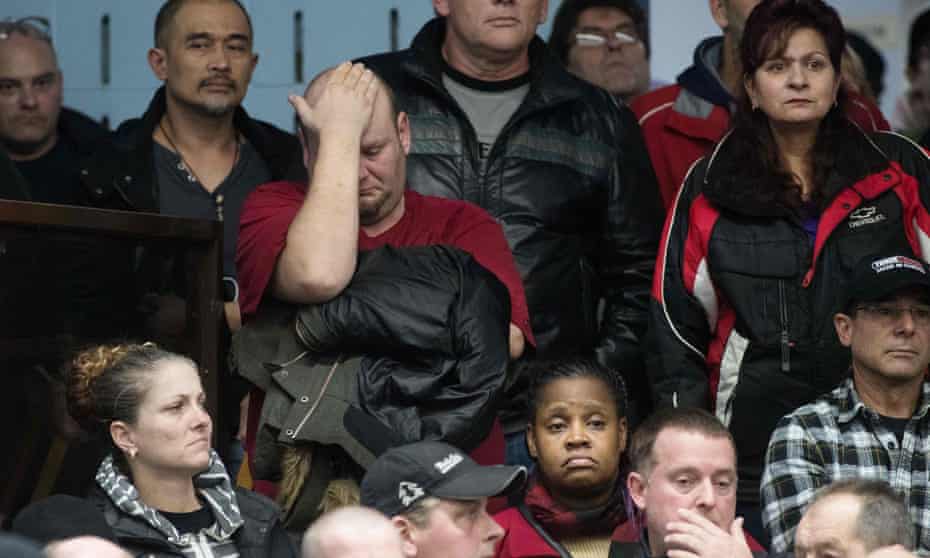 A union member reacts as union leaders speak at Local 222 in Oshawa, Ontario, on 26 November 2018. General Motors announced it was ceasing operations at five plants in the US and Canada, costing more than 14,000 jobs.