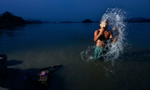 A man bathes in the Bratmaputra river in Guwahati, Assam. Many Indian states have been affected by drought and water scarcity this year.