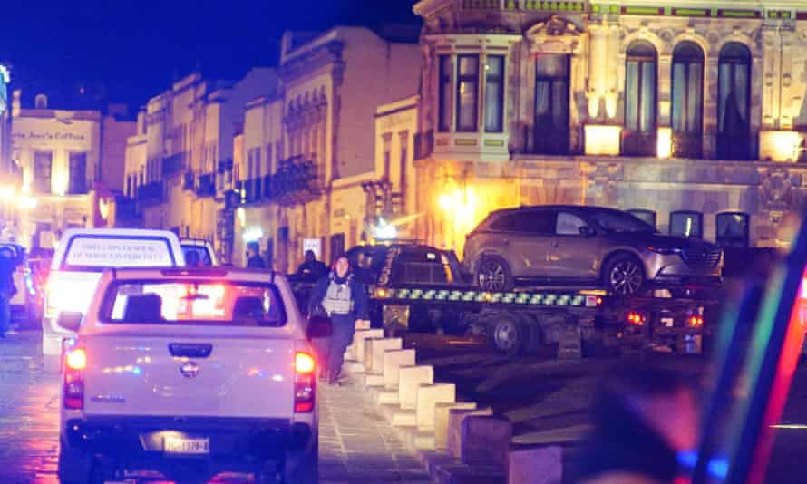 First thing: Biden blames Trump a year after the Capitol attack | 2 Police will remove an SUV with a body left by an unknown perpetrator in front of a government palace in Zacatecas, Mexico, on Thursday.