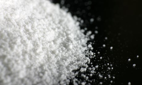 A heap of white powder on black floor