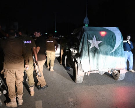 Pakistani security personnel cordon off a road near Nur Khan military airbase after Indian strikes in Rawalpindi early on Saturday