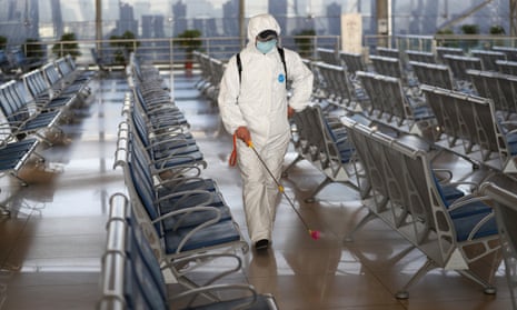 Nanjing Railway Station Takes Measures Against COVID-19 EpidemicNANJING, CHINA - JANUARY 14: Staff member in protective suit sprays disinfectant at the waiting hall of Nanjing Railway Station on January 14, 2021 in Nanjing, Jiangsu Province of China. Railway stations take prevention and control measures against the COVID-19 epidemic. (Photo by VCG/VCG via Getty Images)
