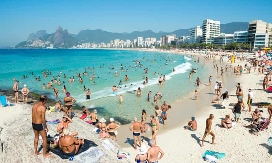 Beachgoers at the Arpoador end of Ipanema Beach