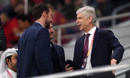 Gareth Southgate (left) talks to FIFA’s global football development Arsène Wenger (right) at a Club World Match match in Qatar.