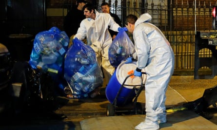 Members of a cleaning crew push a barrel to be loaded in a CDC truck after cleaning the New York apartment of a doctor exposed to Ebola in October 2014. The CDC has been at the forefront the US response to pandemics.