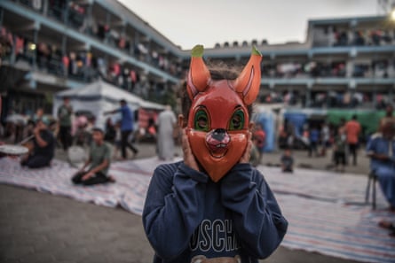 A child with a rabbit mask.