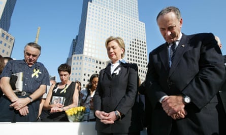 Hillary Clinton and Charles Schumer bow their heads during a moment of silence at Ground Zero.