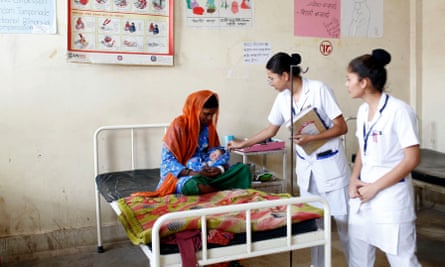 Student nurses talk with Dhan Parta, 25, a new mother whose son was born safely in Bardiya hospital. She had previously had three stillbirths