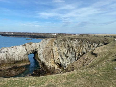 Rock arch and cliff on clear day
