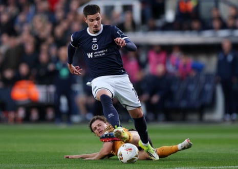 Regan Slater of Hull City challenges Camiel Neghli of Millwall.