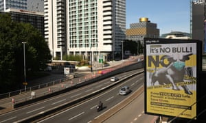Cars on relatively empty roads today passing a giant advertisement asking people to follow public safety advice in Birmingham, where new local restrictions were announced on Friday.