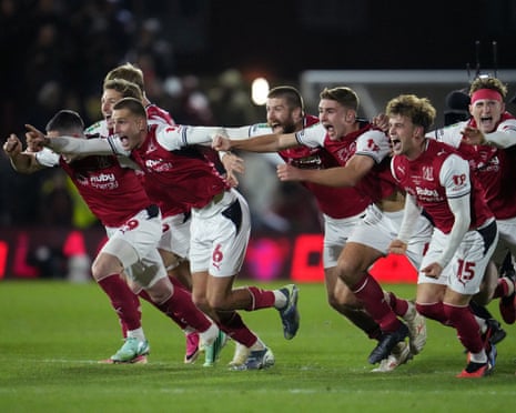 Rhys Bennett and teammates celebrate after FleetwoodâÂÂs penalty shootout win against Arsenal in the Carabao Cup.