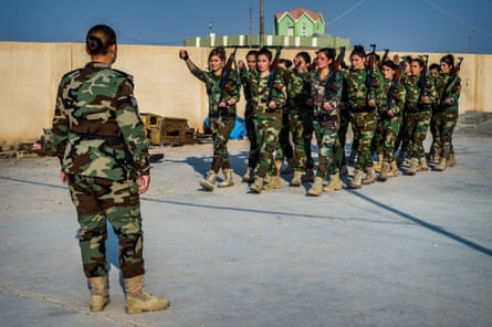 On the move: Khider drills her troops at their base in Snuny in Sinjar province.