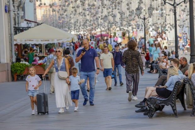 People on the street as daily life continues in Moscow, Russia.