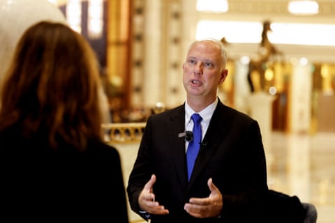 Kirill Dmitriev speaks to media in Saudi Arabia: he is in his 50s, mostly bald with fair wispy hair at the back of his head, and wears frameless spectacles.