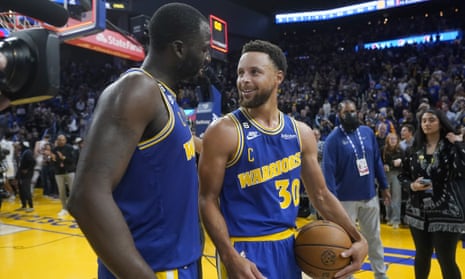 Draymond Green and Stephen Curry leave the court after their victory over the Sacramento Kings
