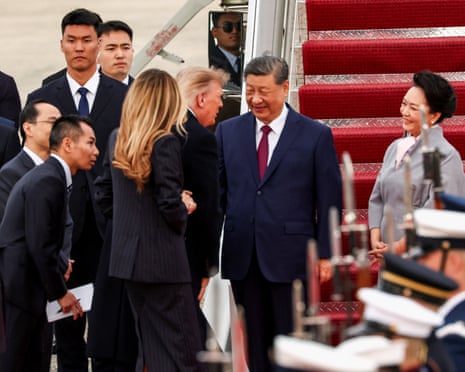 Donald Trump welcomes Xi Jinping on arrival at Joint Base Andrews, with Melania Trump next left and Peng Liyuan at right