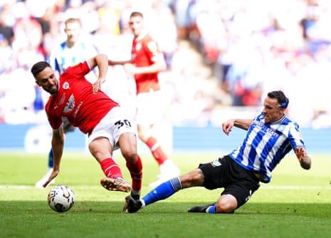 Adam Phillips in action against Sheffield Wednesday’s Lee Gregory in the League One playoff final back in 2023.