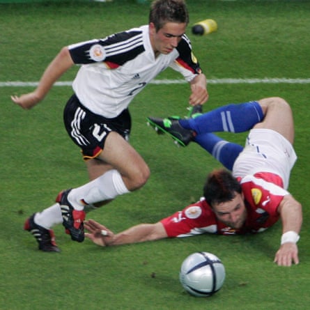 Philipp Lahm skips past the tackle of the Czech Republic’s Vratislav Lokvenc during Germany’s Euro 2004 group game