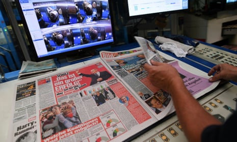 A worker checks a printed edition of Bild newspaper
