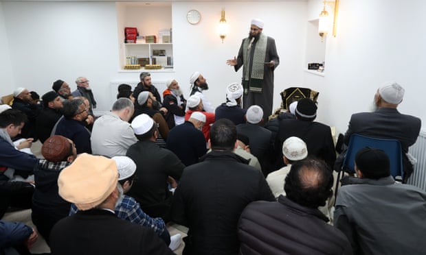 Iman Mufti Abdur Rahman Mangera speaks to members of devotees in Stornoway as they attend the official opening of the mosque.