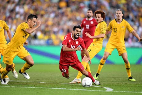 Mohamad Haidar of Lebanon is tackled by Mustafa Amini of the Socceroos during the International friendly match between Australia and Lebanon at ANZ Stadium in Sydney.