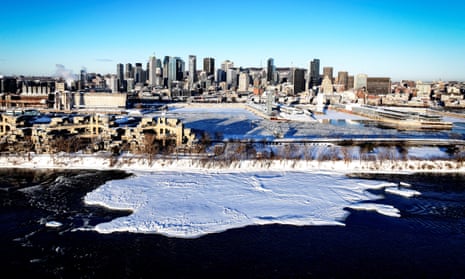 overhead view of cityscape beside icy river
