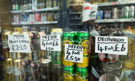 Alcoholic drinks are advertised at an off-licence.