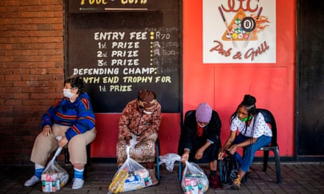 People check food parcels from Meals on Wheels in Brapkan, Gauteng province, near Johannesburg.