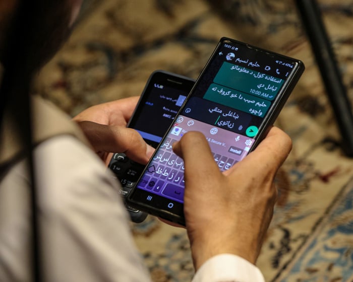 Taliban order ban on smartphones as officials shown destroying devices